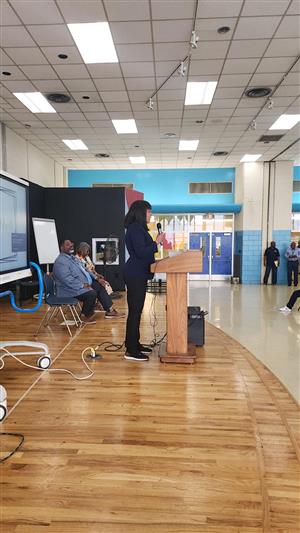 teacher speaking at promotion
